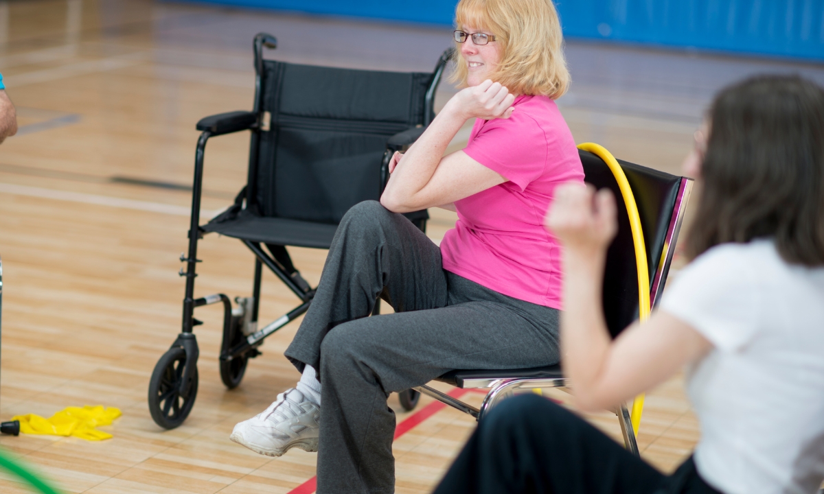 a person in a wheelchair doing exercise