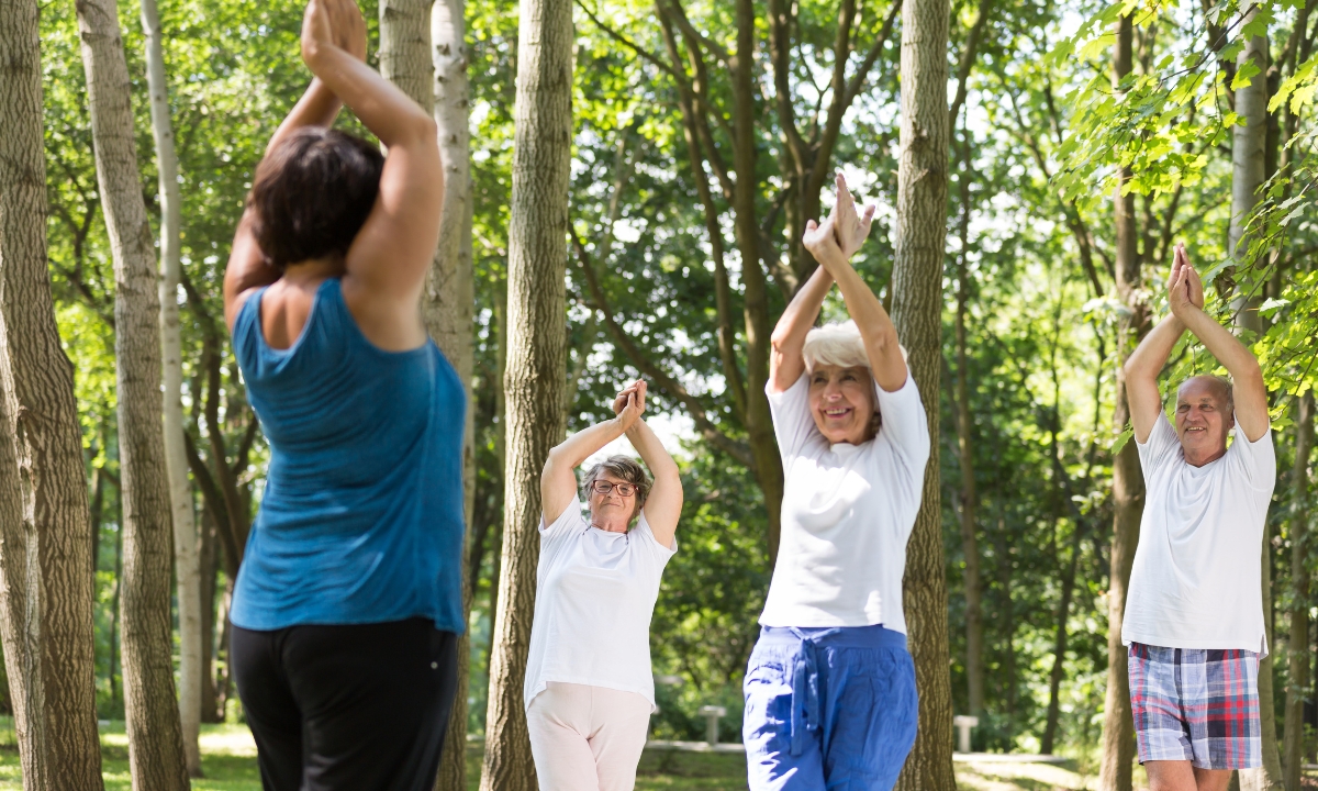 a group of seniors doing yoga