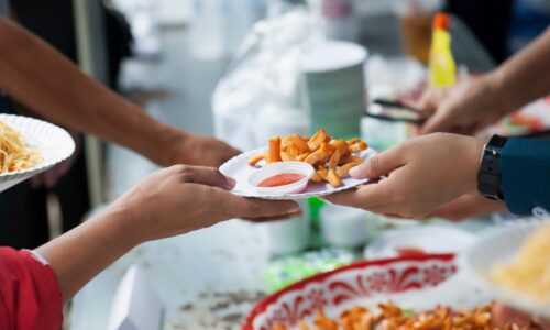 hands exchanging food